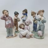 A Nao figure, of a boy with a football, and five other Nao figures of children, with boxes (6)