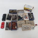 A group of 00 gauge model railway accessories, including figures, cattle, and signs