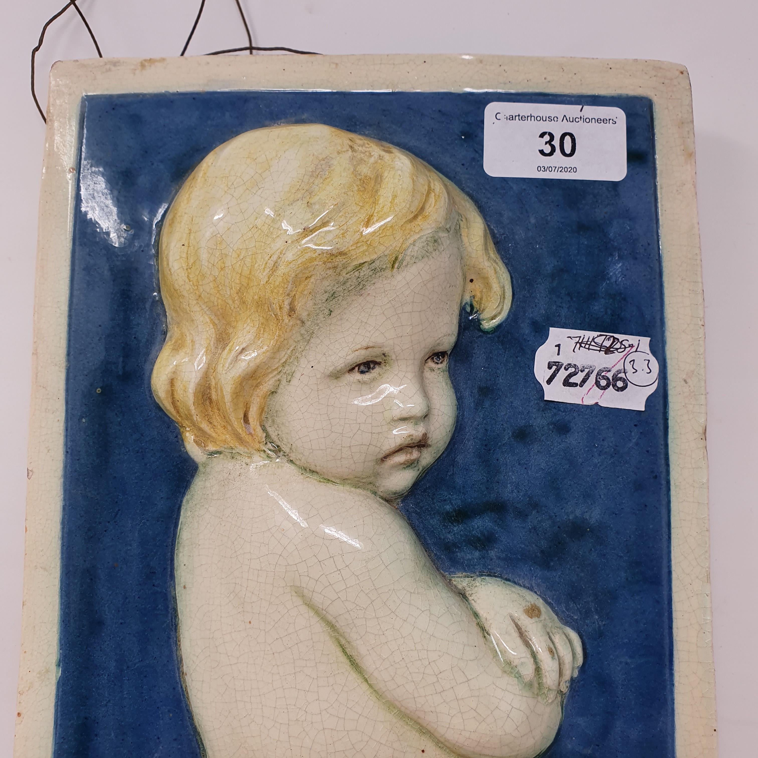 A Della Robia pottery plaque, decorated a child, signed in script D (painted ship) R 14 Morte (?) C, - Image 2 of 6