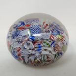 A Baccarat scrambled glass paperweight, with various latticino and coloured glass canes, 6.2 cm