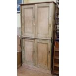 A pair of stripped pine cupboards, with sliding doors, 110 cm wide (2)