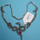 A silver, marcasite and ruby set snake necklace