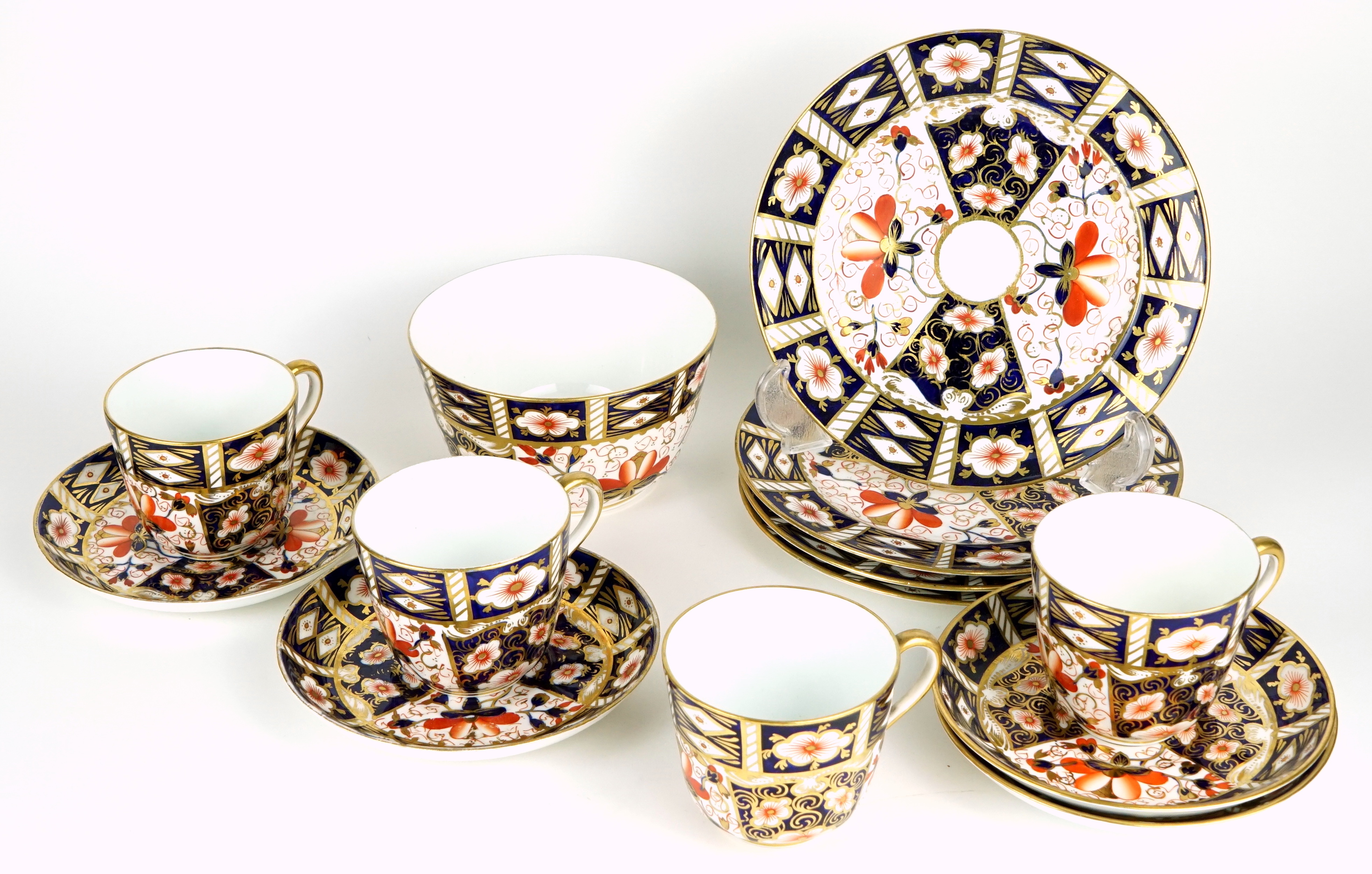 A Royal Crown Derby Imari pattern (2451) thirteen-piece part tea service comprising four cups,