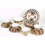 A Royal Crown Derby Imari pattern (2451) thirteen-piece part tea service comprising four cups,