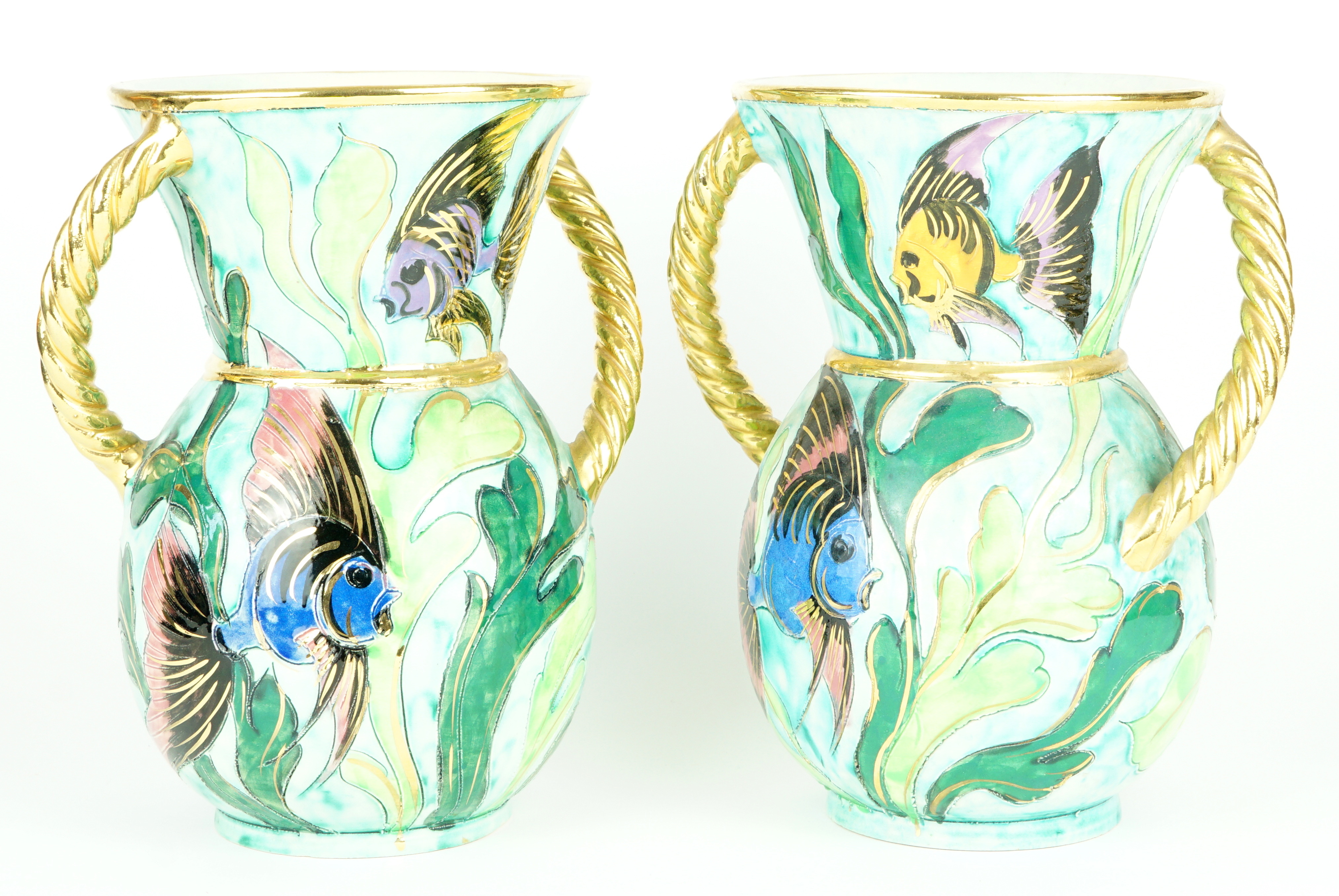 A pair of Vallauris French art pottery twin-handled vases, decorated with exotic fish amongst