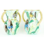 A pair of Vallauris French art pottery twin-handled vases, decorated with exotic fish amongst