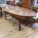 A desk/table, veneered in burr walnut, with six drawers to the frieze, 210 cm wide