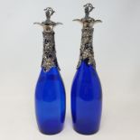 A pair of blue glass decanters, with plated mounts and stoppers, 33.5 cm high (2) Report by RB