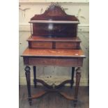 A French rosewood bonheur du jour, with brass mounts, the superstructure with a shelf and two