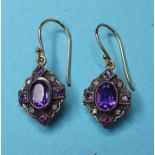 A pair of 9ct gold, silver, amethyst, and diamond earrings
