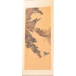 A Japanese painted hanging scroll, decorated with an eagle in a pine tree, signed, the image 93 cm x