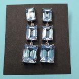 A pair of silver, aquamarine and blue topaz drop earrings sizes aprox, 46mm long, largest stone 11mm