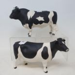 A Beswick Friesian cow, 1362A and a Friesian bull, 1439A, both matt and boxed (2)