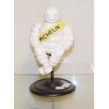 A Michelin painted figure, on a stand, 28 cm high Report by RB Modern