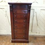 A late Victorian mahogany Wellington chest, of seven graduated long drawers, on a plinth base, 51 cm