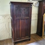 A Gothic style oak cupboard, with linen fold panels, 92 cm wide