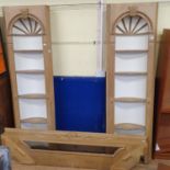 A pair of stripped pine open corner cupboards, in the 18th century taste, with a pine pediment