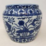 A CHinese pottery jardiniere, decorated fish and foliage in underglaze blue, 17.5 cm high firing