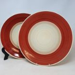 A pair of Susie Cooper chargers, with red ?Wedding Band? decoration, printed factory marks to bases,