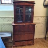 A Biedemeir mahogany secretaire bookcase, having a pair of bar glazed doors above a secretaire