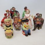 A group of Royal Doulton figures and toby jugs, including, The Foaming Quart, HN2162, the Jester,