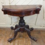A Victorian card table, the shaped top veneered in burr walnut, on a carved base, 92 cm wide