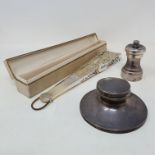 A late 19th/early 20th century fan, in a silk box, a modern silver pepper mill, and a silver capstan