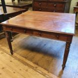 A mahogany library table, with two pairs of frieze drawers, on tapering reeded legs, 122 cm wide