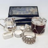 A silver cream jug, London 1909, four silver napkin rings, and other items Report JS Drum silver