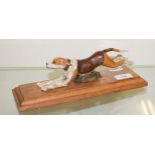 A painted bronze running dog paperclip, on an oak base, 28 cm wide Report by RB Modern