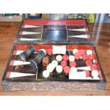 A set of late 19th century Chinese stained and natural backgammon pieces, with a folding box