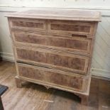 An 18th century style chest, veneered in burr walnut, having two short and three graduated long