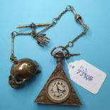 A brass masonic watch, on a skull albert