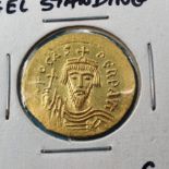 A gold solidus, angel standing