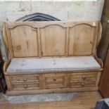 A stripped pine settle, with drawers below, 150 cm wide