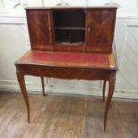 A French kingwood bonheur du jour, the superstructure with cupboards, a recess and drawers above a