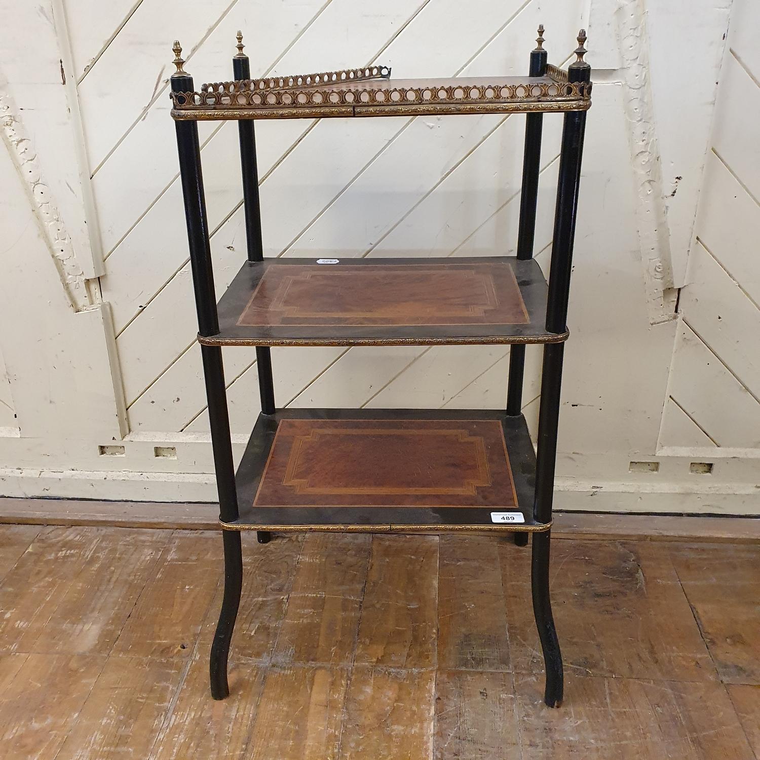 An ebonised three tier etagere, inlaid with amboyna and crossbanded, 45 cm wide Report by RB One