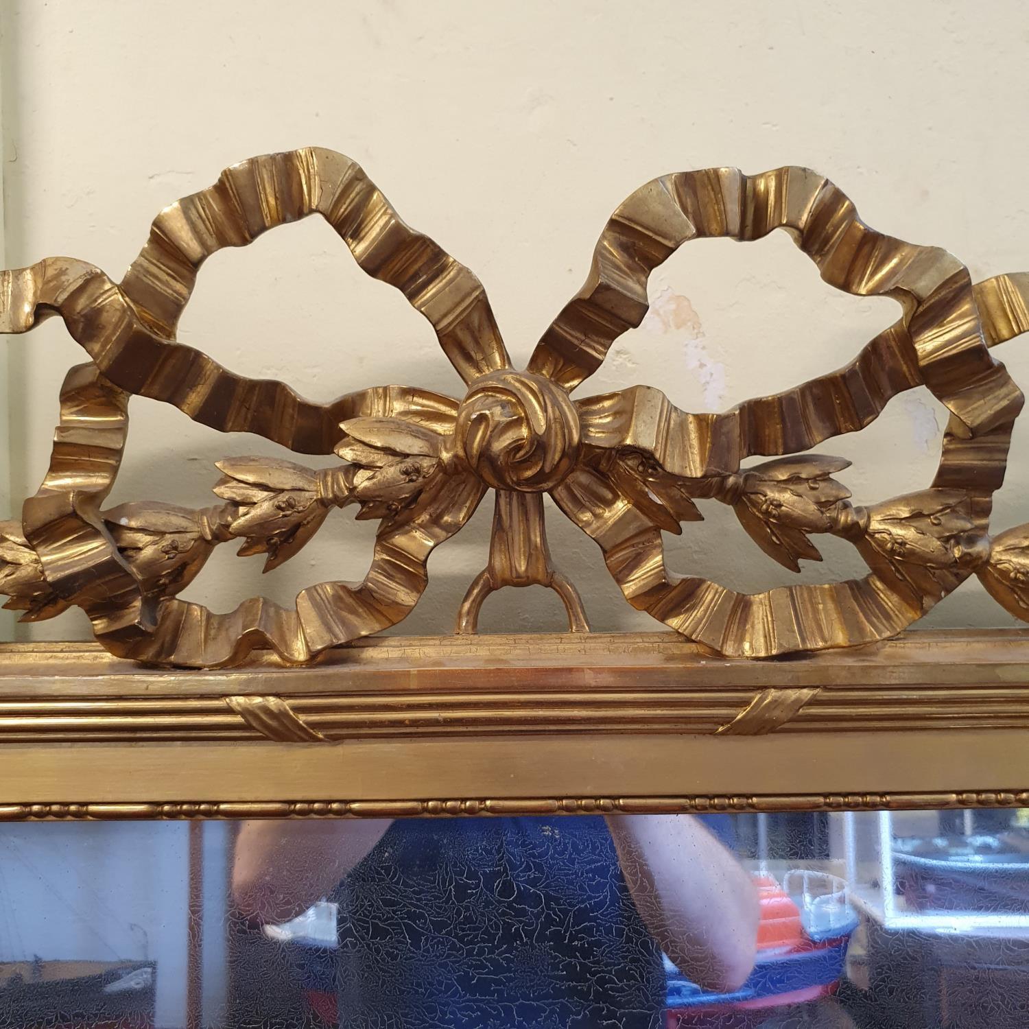 A French overmantel mirror, with a ribbon tie bow and bell flower surmount, 115 cm wide x 180 cm - Bild 2 aus 3