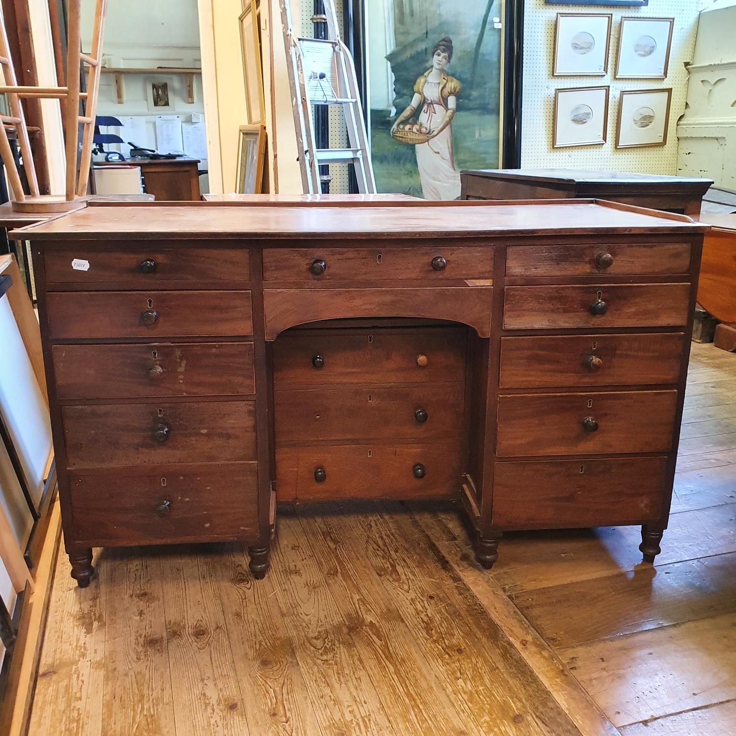 A 19th century mahogany desk, with an arrangement of drawers, 135 cm wide