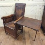 An unusual 19th century country made armchair, incorporating a drop leaf table section