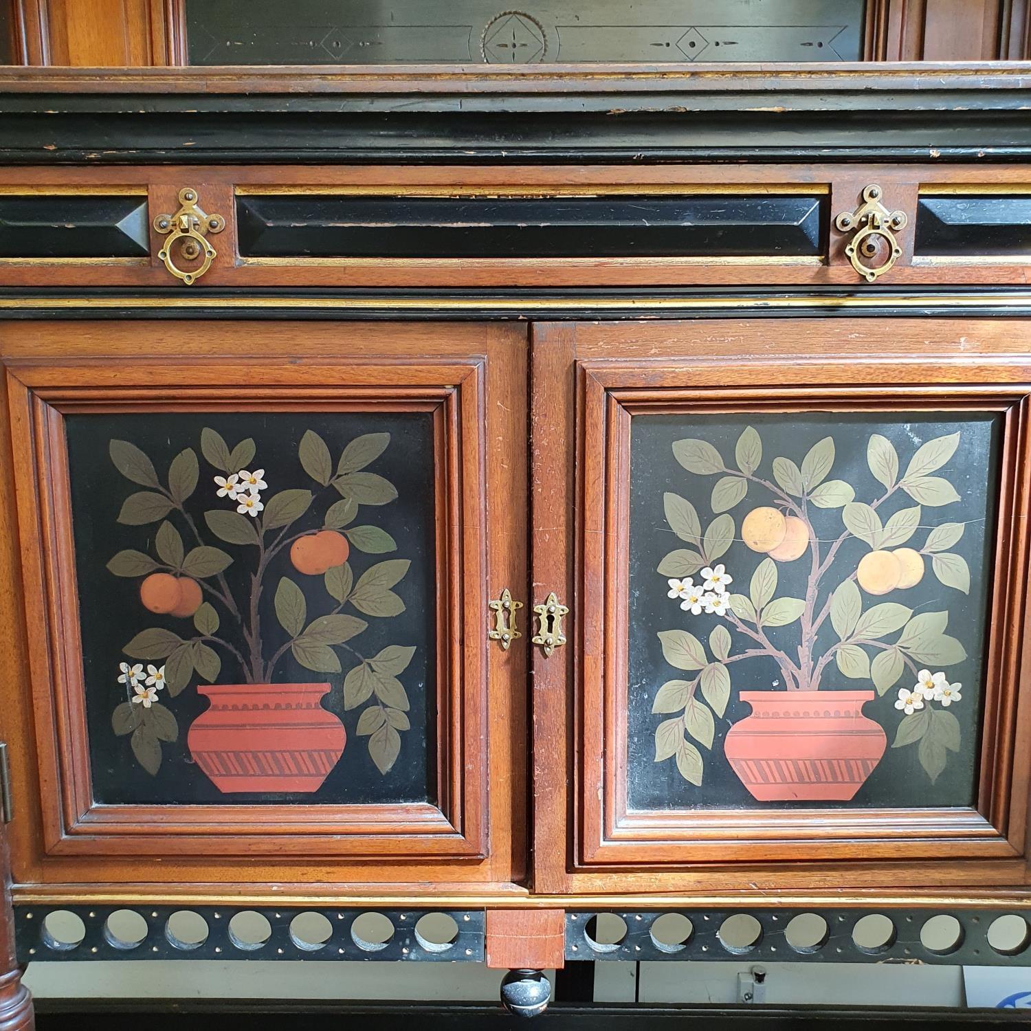 A late 19th century Aesthetic Movement walnut, ebonised and painted side cabinet, the raised back - Bild 2 aus 3