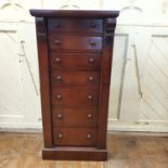 A late Victorian mahogany Wellington chest, of seven graduated long drawers, on a plinth base, 51 cm