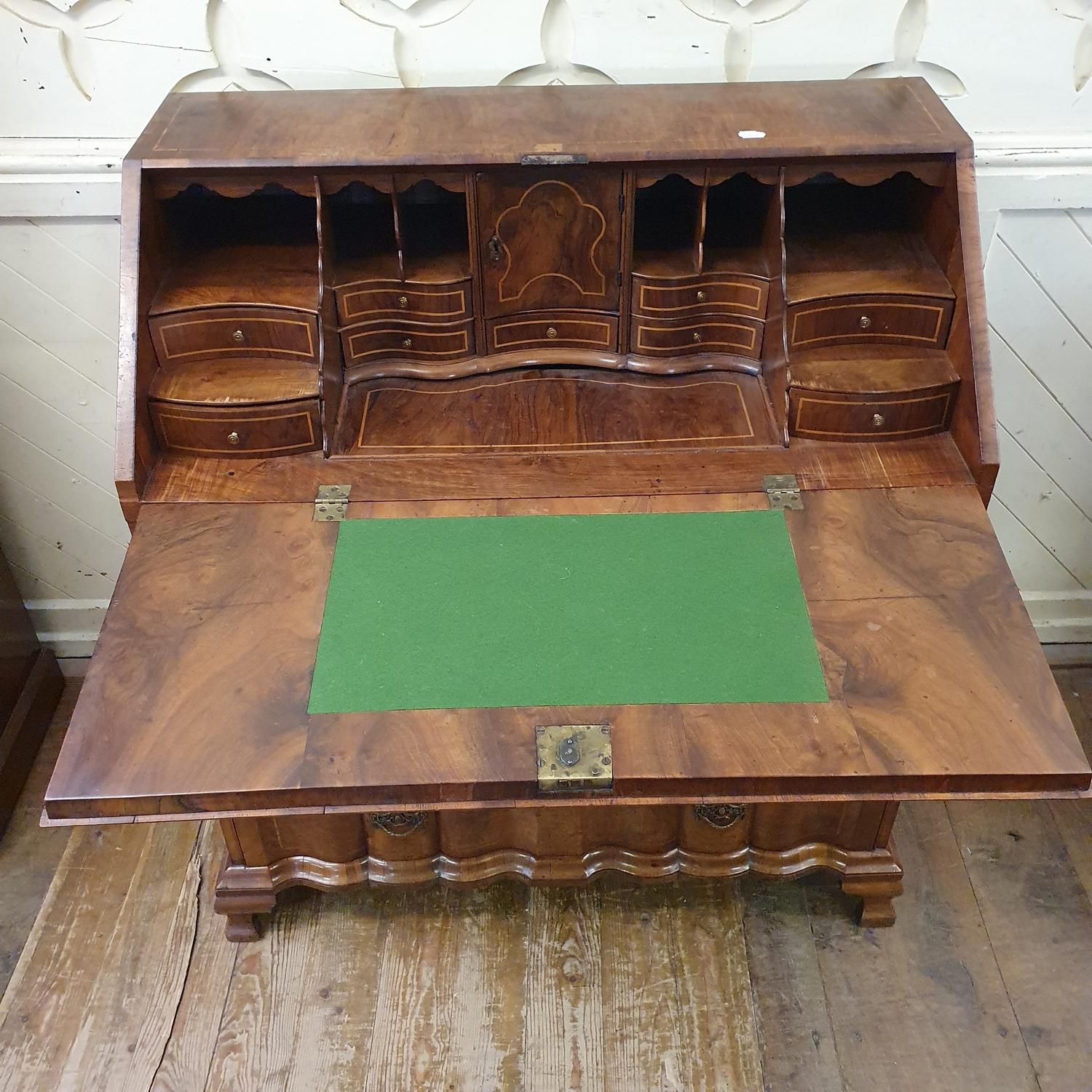 An 18th century Continental walnut bureau, the fall front revealing a fitted interior and a well, - Bild 5 aus 8