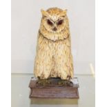 A painted bronze owl, perched on a hinged book, 26 cm high Report by RB Modern