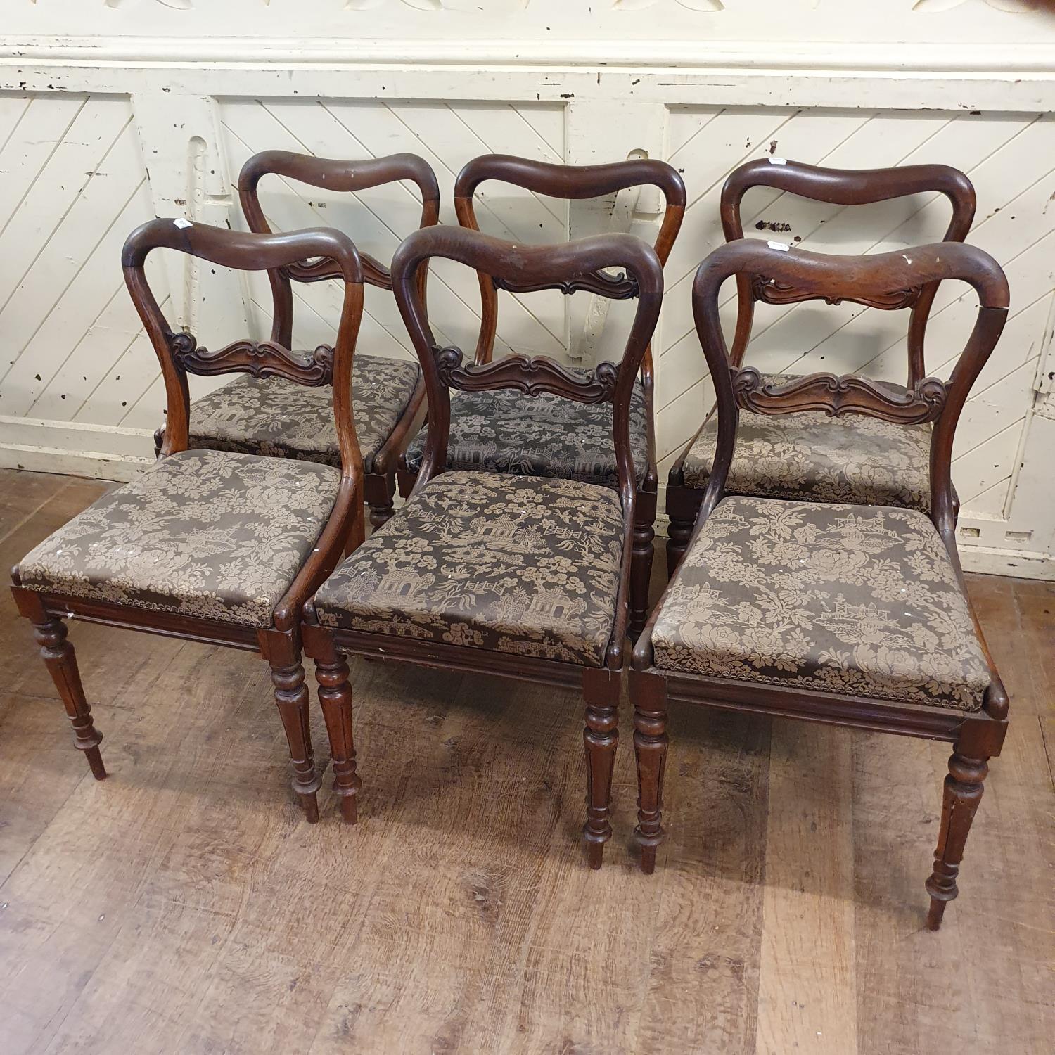 A set of six Victorian rosewood dining chairs, with drop in seats and turned front legs (6) Report