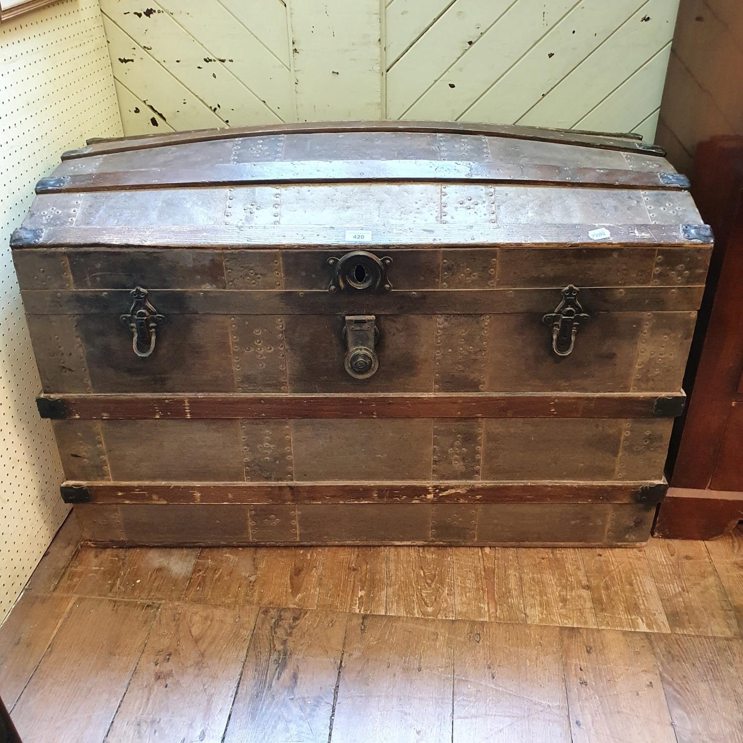 A dome topped travelling trunk, with a fitted interior, 103 cm wide