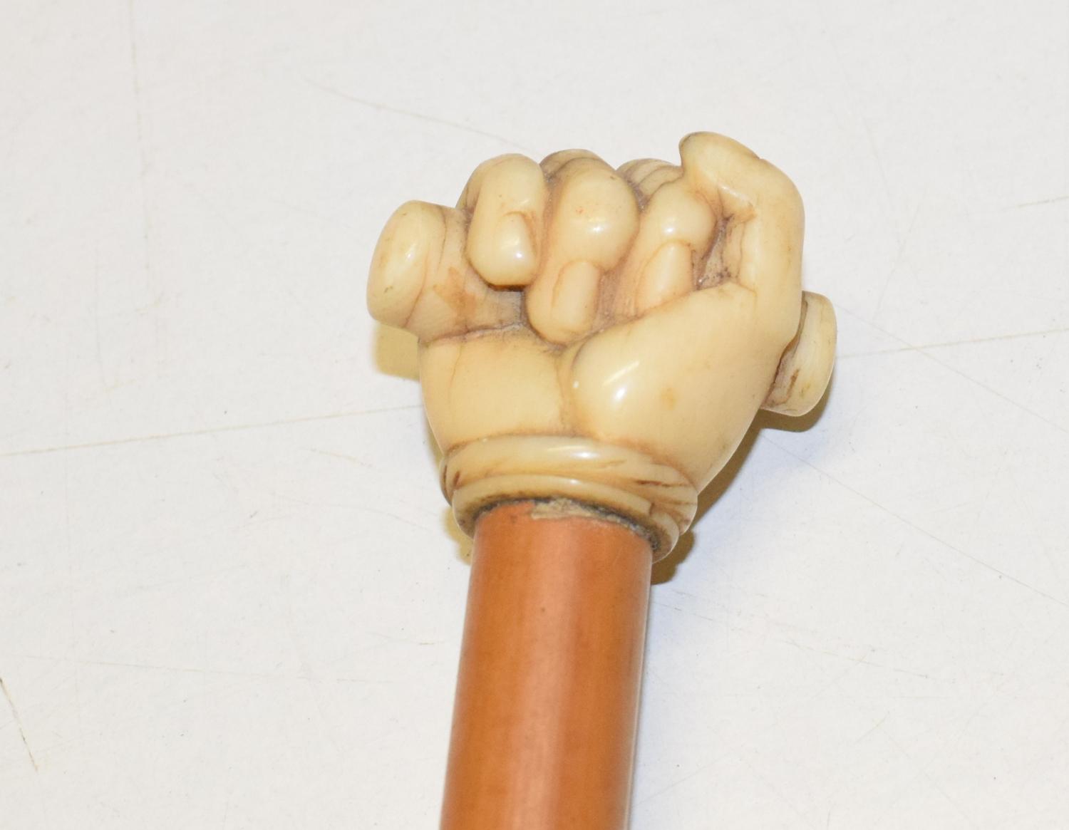 A 19th century mallacca cane, the finial carved as a clenched fist, length 81 cm - Bild 8 aus 8