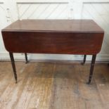 An early 19th century mahogany Pembroke table, on tapering turned legs, 103 cm wide