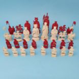 An early 20th century Chinese carved and stained ivory chess set, the King 10 cm, removal cost A