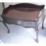 A Chippendale style mahogany dressing table, with a three quarter gallery back, three frieze